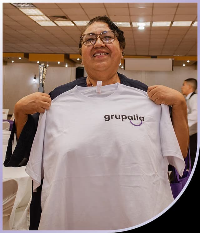 Woman holding Grupalia branded shirt